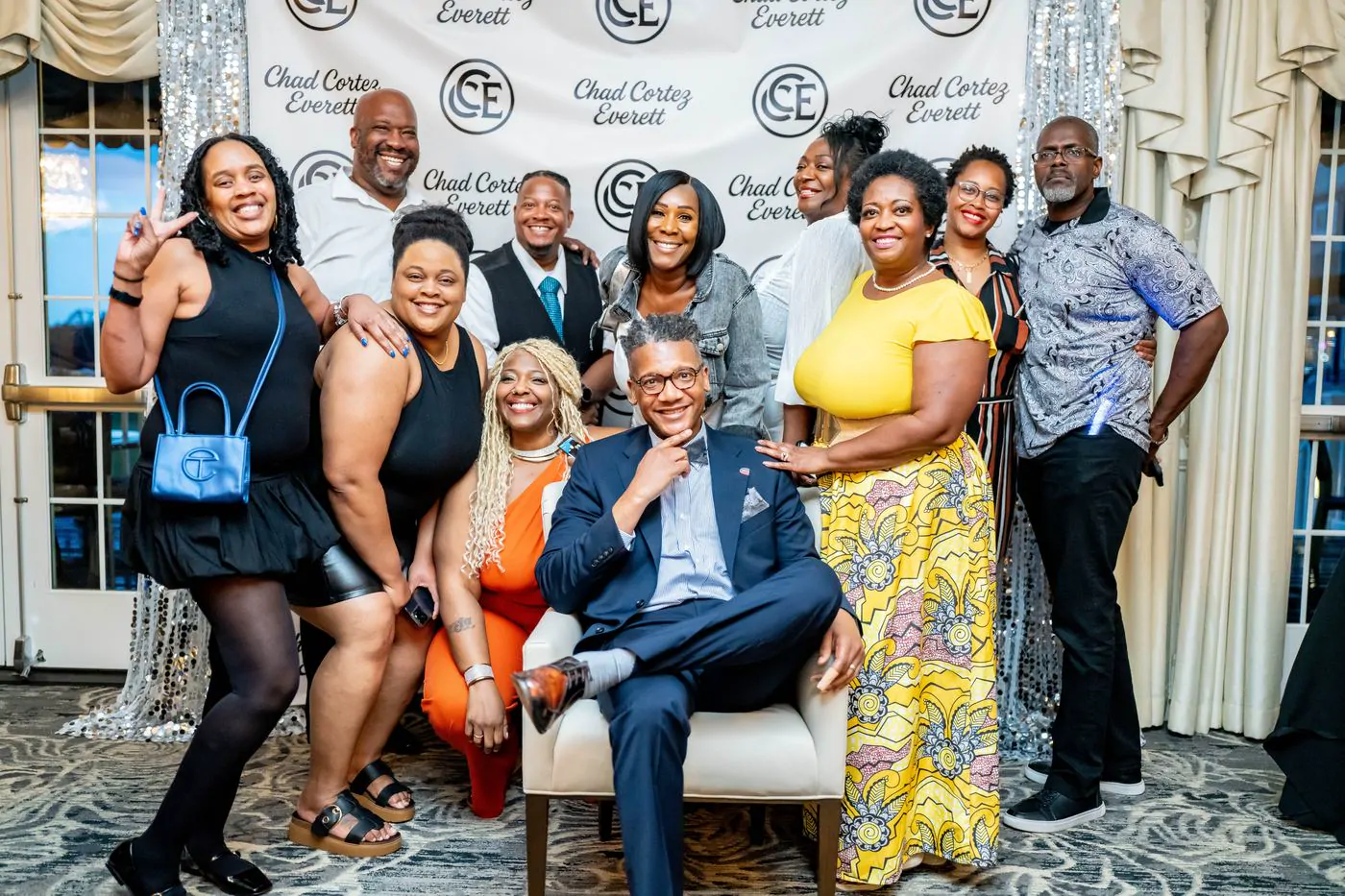 Guests gathered for a group photo at a 50th birthday celebration