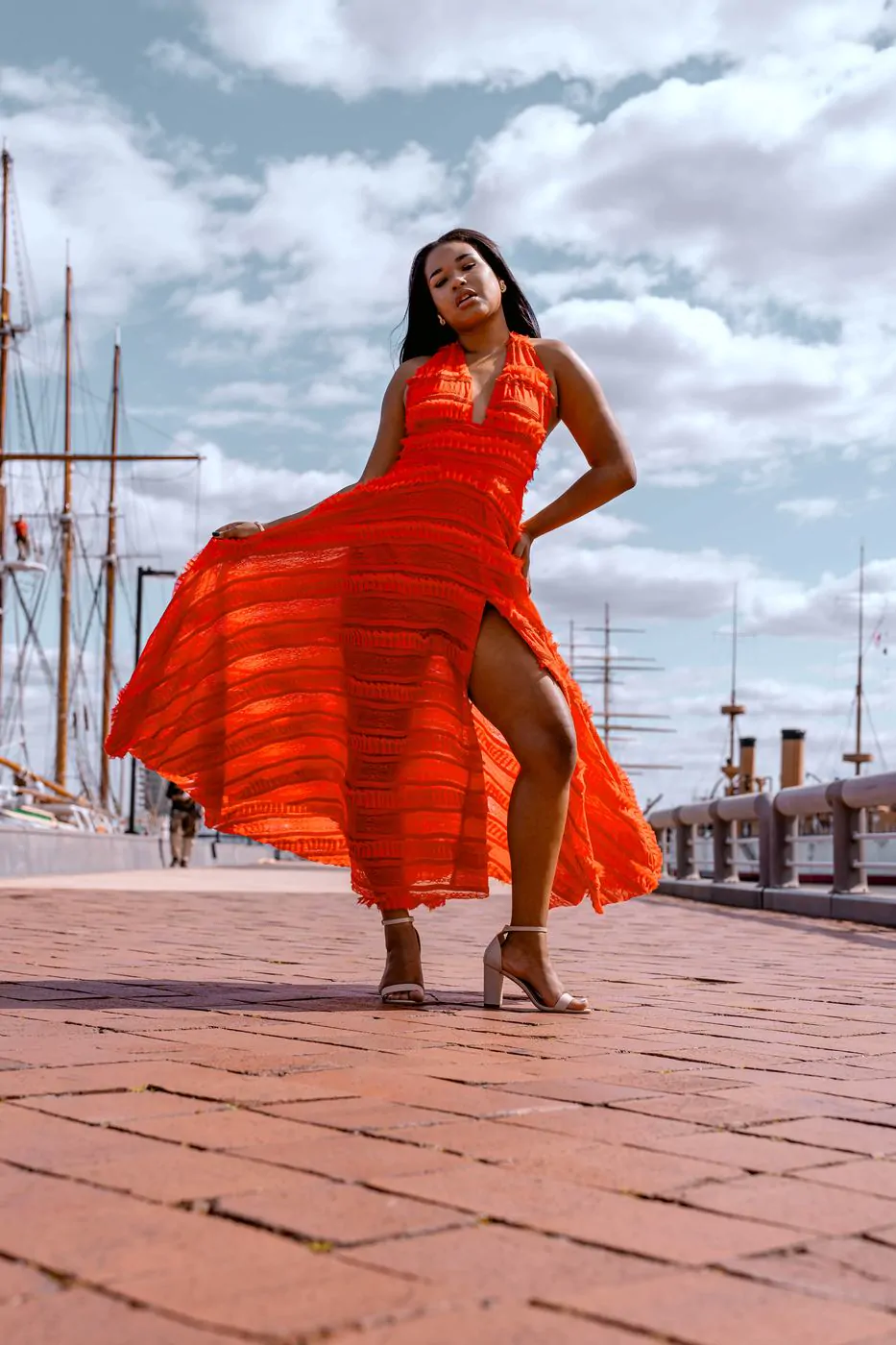 Editorial fashion photography, flowing orange dress